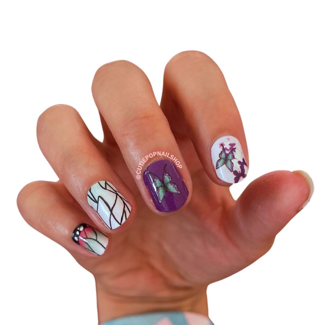 Butterflies nail stickers by Cutie Pop Nail Shop featuring ultra thin 2D designs of colorful butterflies in various sizes and styles, accented with pastel tones and soft whimsical details arranged on a pink edged display card labeled "Easy Peel & Apply Nail Sticker
