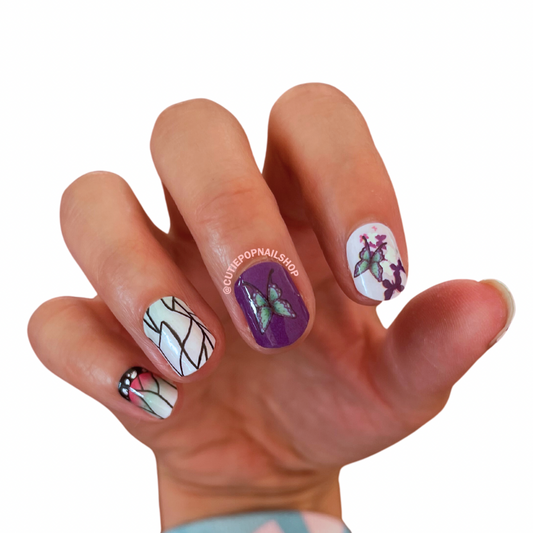 Butterflies nail stickers by Cutie Pop Nail Shop featuring ultra thin 2D designs of colorful butterflies in various sizes and styles, accented with pastel tones and soft whimsical details arranged on a pink edged display card labeled "Easy Peel & Apply Nail Sticker