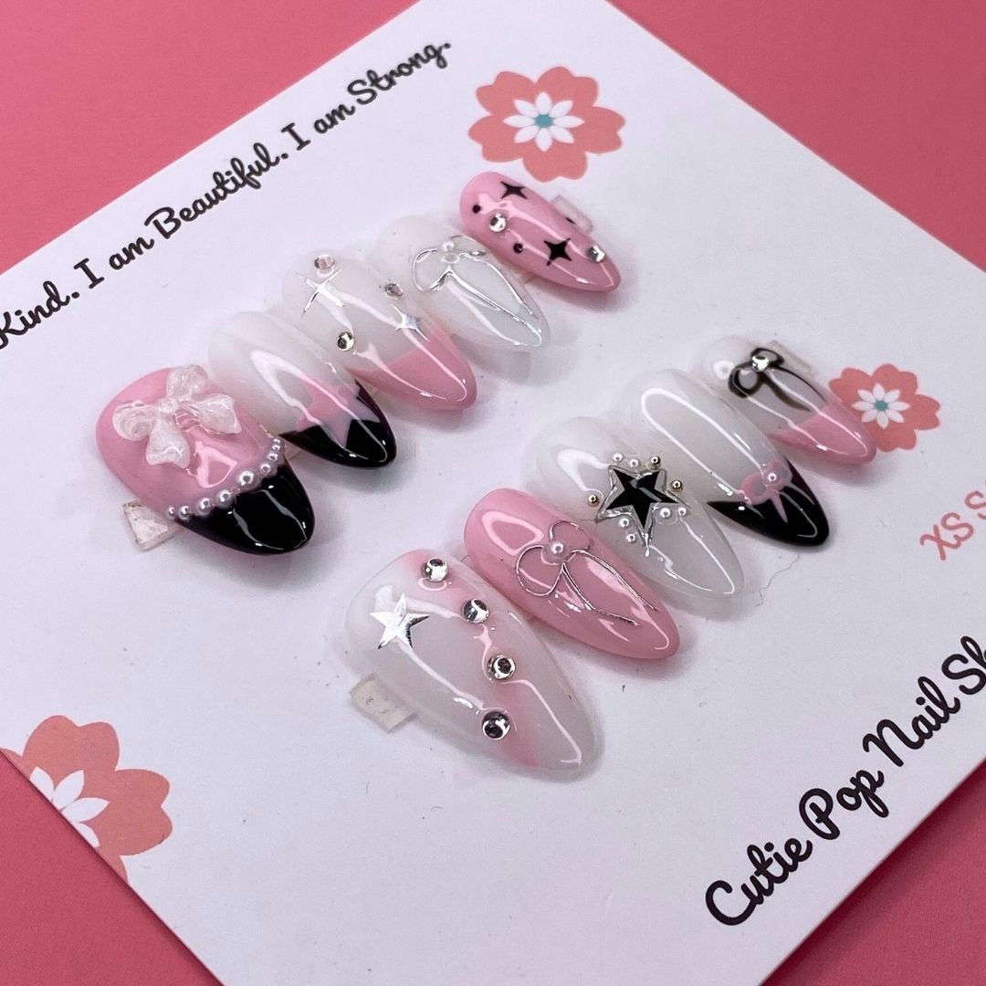 Bloom Coquette press on nails by CutiePop Nail Shop featuring round shaped nails in soft pink tones with floral designs, pearl accents, and a flirty coquette-inspired aesthetic.