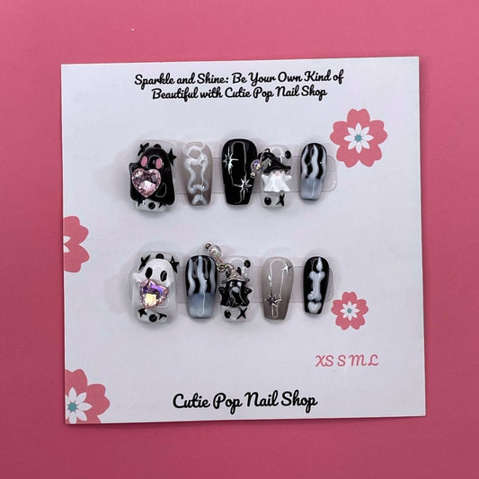 Cute Ghost press-on nails by CutiePop Nail Shop, designed with a pastel theme featuring playful ghost designs, soft glitter, and adorable Halloween elements in pink, purple, and white tones.