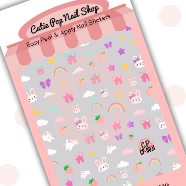 Dreamy Bunny nail stickers by Cutie Pop Nail Shop featuring whimsical bunny characters, moons, stars, clouds, and dreamy pastel elements arranged on a pink edged display card labeled "Easy Peel & Apply Nail Stickers."