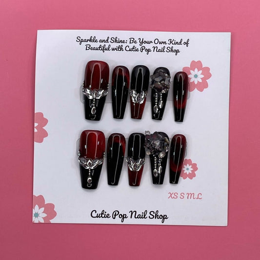 Elegant Spice press on nails by CutiePop Nail Shop featuring coffin shaped nails in warm amber and nude tones with a glossy finish and subtle gold accents for a refined, sophisticated look.