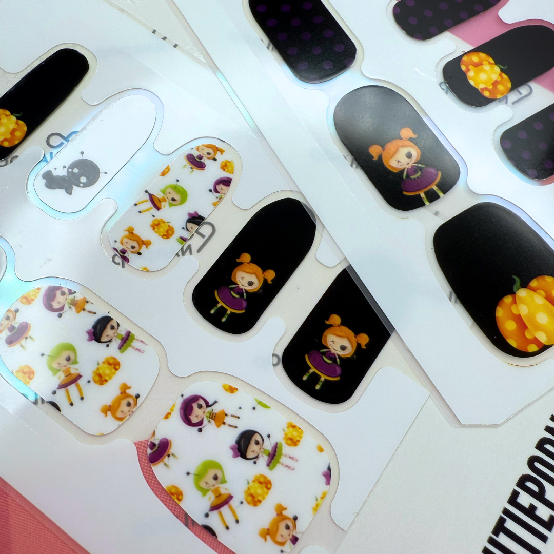 Voodoo Boo Halloween nail wraps with voodoo dolls, pumpkins, and polka dots