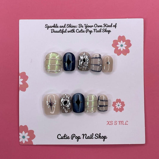 Mythical Dream press on nails by CutiePop Nail Shop featuring short squoval shaped nails in dreamy pastel tones with fantasy-inspired elements like stars, moons, and subtle shimmer for a soft, magical look.