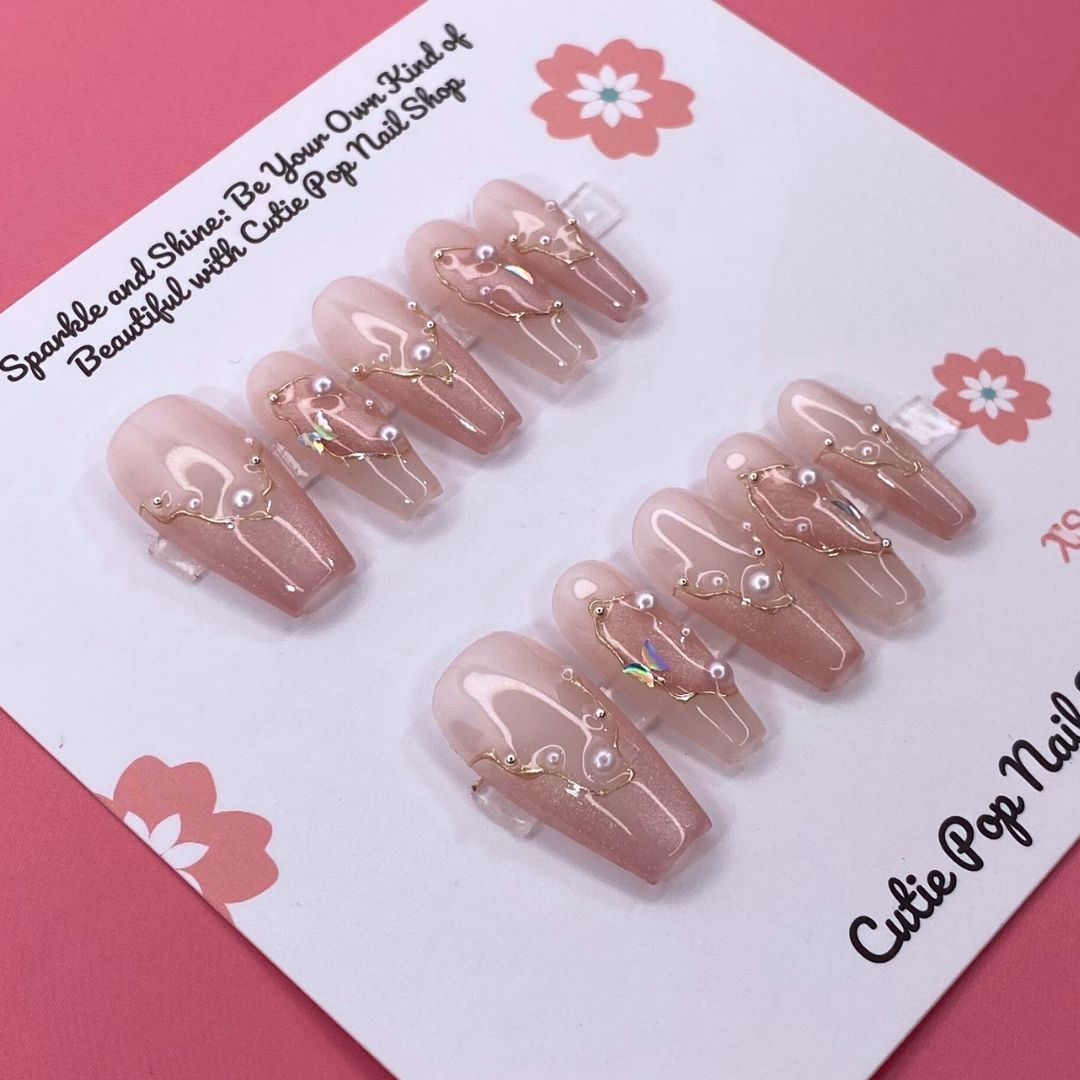 Soft Blush press on nails by CutiePop Nail Shop featuring long coffin shaped nails in soft pink tones with elegant pearl accents for a clean, classy, and feminine look.