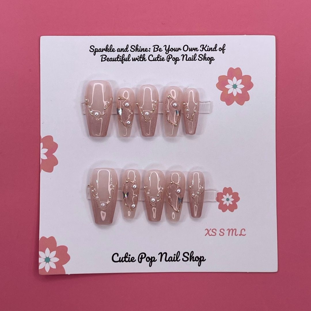 Soft Blush press on nails by CutiePop Nail Shop featuring long coffin shaped nails in soft pink tones with elegant pearl accents for a clean, classy, and feminine look.