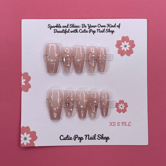 Soft Blush press on nails by CutiePop Nail Shop featuring long coffin shaped nails in soft pink tones with elegant pearl accents for a clean, classy, and feminine look.