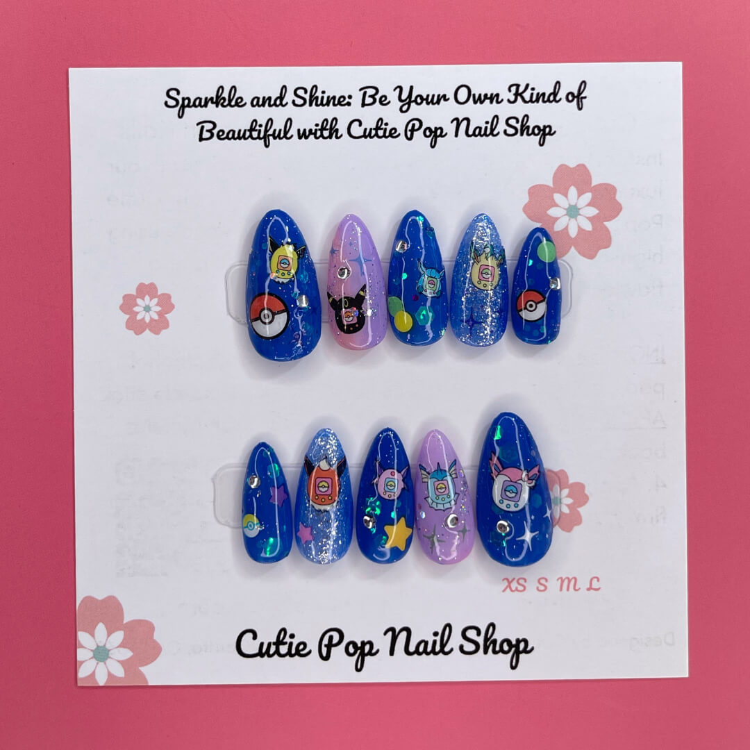 Digipet Evolution press on nails by CutiePop Nail Shop featuring medium almond shaped nails with a glossy royal blue and purple gradient, hand painted with nostalgic anime-style Digipet character silhouettes and sparkly star accents. Includes an easy press on reusable set: adhesive tabs, mini nail file, and cuticle stick.