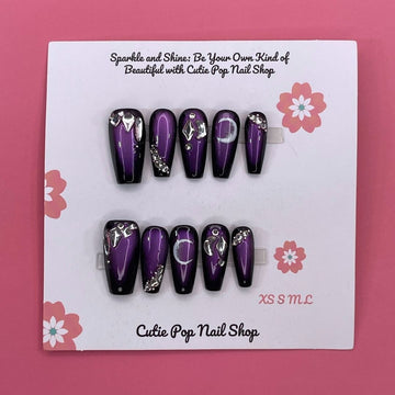 Golden Lady press-on nails by CutiePop Nail Shop featuring medium-length coffin-shaped nails in elegant nude and gold tones. Accented with fine glitter, metallic details, and a glossy finish, this set exudes a luxurious, feminine aesthetic perfect for special occasions or a glam everyday look. Includes 10 reusable handmade nails, jelly adhesive tabs, a mini nail file, and a cuticle stick for easy application.