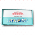 Mercury press on nails by CutiePop Nail Shop featuring medium stiletto shaped nails in pastel aqua blue and soft white tones. Several accent nails highlight hand painted chibi-style Princess Mercury illustrations, crescent moon decals, holo-flake glitter, and water droplet motifs. Finished with a glossy gel coat and metallic shimmer that capture Sailor Mercury’s graceful, aquatic elegance. The set includes 10 reusable handmade nails, jelly adhesive tabs, mini nail file, and cuticle stick.