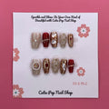 Cleopatra press on nails by CutiePop Nail Shop featuring medium coffin shaped nails in bold gold and black tones with Egyptian-inspired patterns, metallic accents, and a regal, luxurious vibe.

