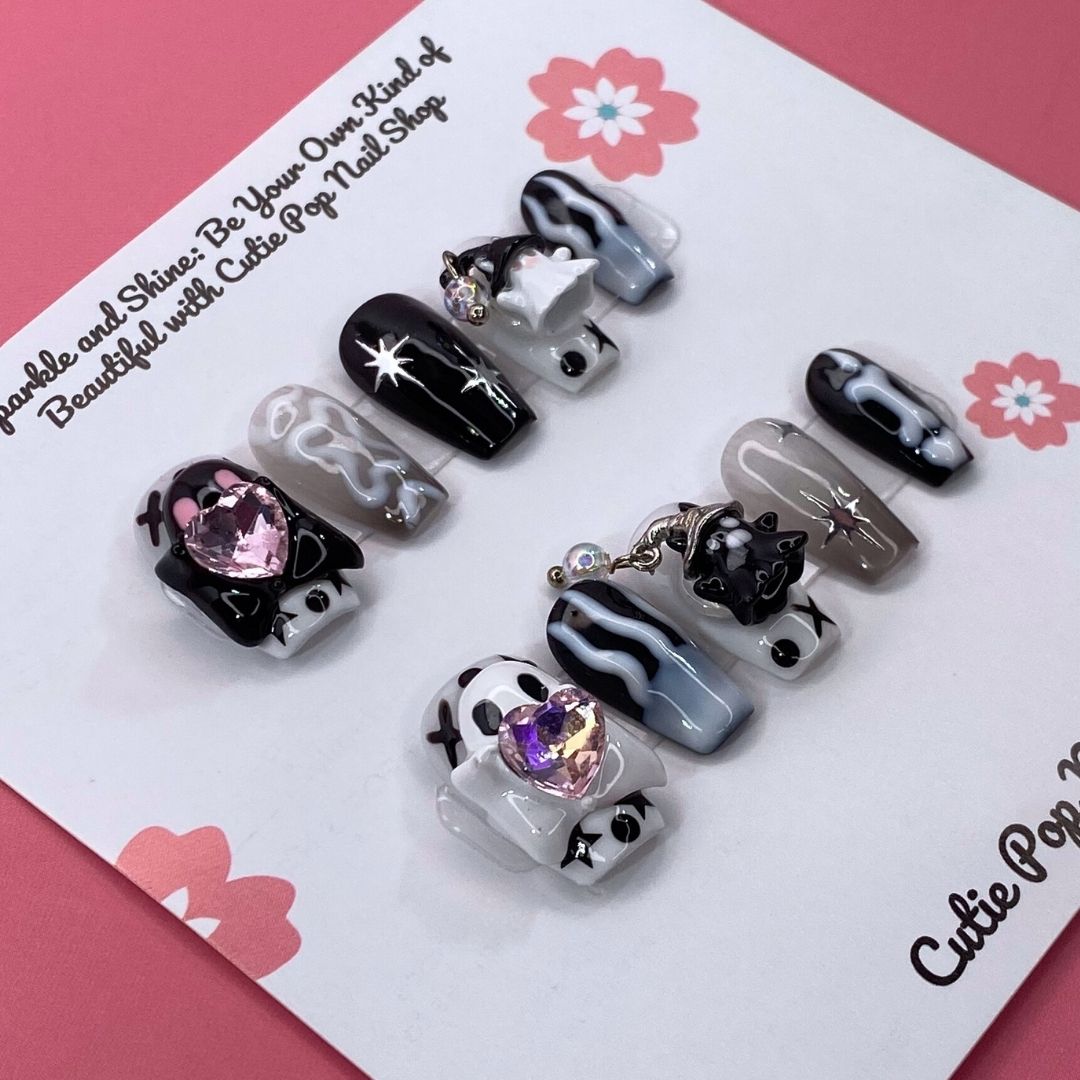 Cute Ghost press-on nails by CutiePop Nail Shop, designed with a pastel theme featuring playful ghost designs, soft glitter, and adorable Halloween elements in pink, purple, and white tones.