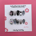 Cute Ghost press-on nails by CutiePop Nail Shop, designed with a pastel theme featuring playful ghost designs, soft glitter, and adorable Halloween elements in pink, purple, and white tones.