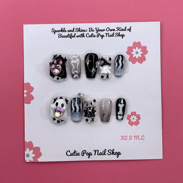 Cute Ghost press-on nails by CutiePop Nail Shop, designed with a pastel theme featuring playful ghost designs, soft glitter, and adorable Halloween elements in pink, purple, and white tones.