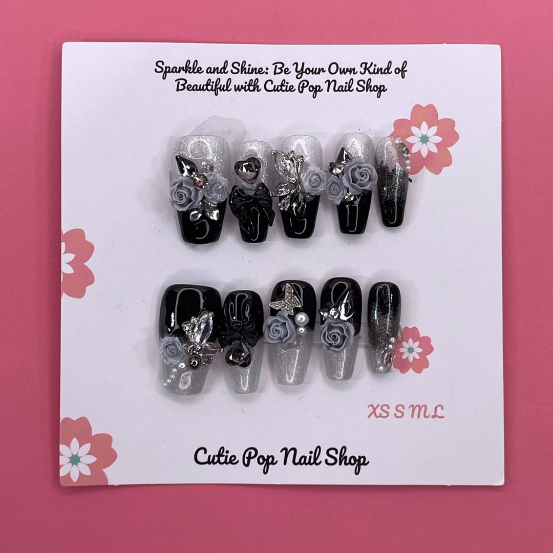 Dark Aura press on nails by CutiePop Nail Shop featuring long coffin shaped nails with a glossy black base layered with smoky gradient aura effects in deep purples and iridescent shimmer, finished with subtle metallic accents for a dramatic, gothic elegant aesthetic.

