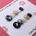 Flower Gem press-on nails by CutiePop Nail Shop featuring short-length squoval-shaped nails in soft pastel tones. Embellished with intricate 3D floral designs and sparkling gem accents, these nails offer a delicate and elegant aesthetic perfect for springtime charm or everyday beauty. Includes 10 reusable handmade nails, jelly adhesive tabs, a mini nail file, and a cuticle stick for effortless application.