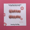 Glittery Blush press on nails by CutiePop Nail Shop featuring short squoval shaped nails in soft blush pink tones with a glittery, shimmering finish for a subtle yet elegant sparkle.

