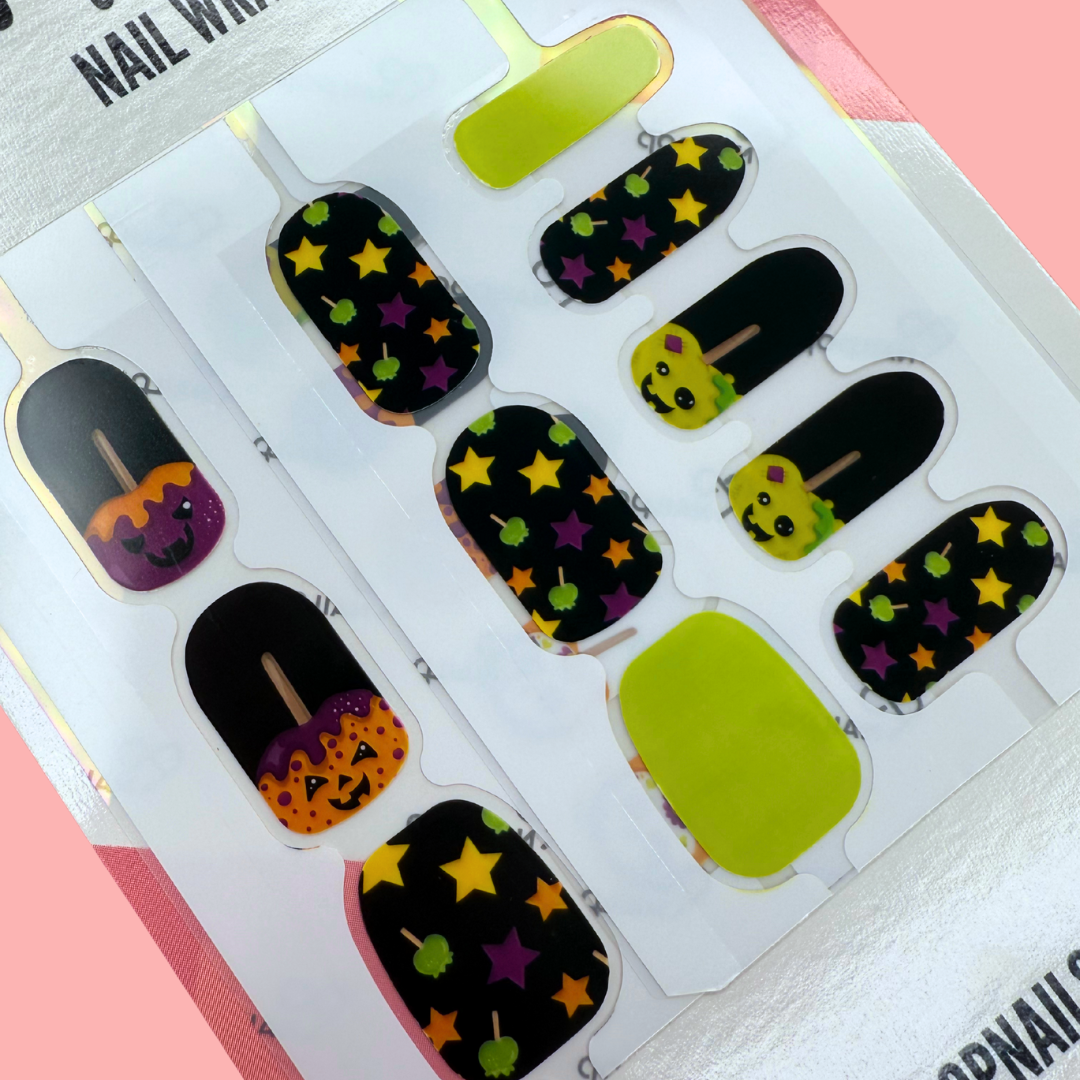 Spooky Apple Halloween nail wraps with candy apples, pumpkins, and star designs