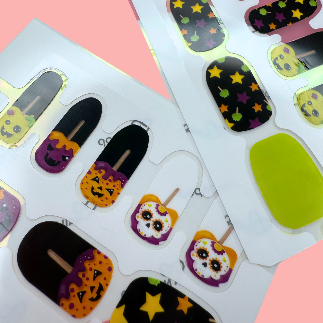 Spooky Apple Halloween nail wraps with candy apples, pumpkins, and star designs