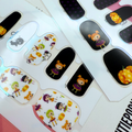 Voodoo Boo Halloween nail wraps with voodoo dolls, pumpkins, and polka dots