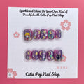 Usagi Stars press on nails by CutiePop Nail Shop featuring short squoval shaped nails in a kawaii-inspired color palette of soft pastel pinks, baby blue, and lavender. Adorned with hand-painted or foil motifs of crescent moons, stars, and rabbit-themed accents (like bunny ears or silhouettes), and finished with a glossy gel polish for dreamy, whimsical magic.