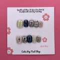 Mythical Dream press on nails by CutiePop Nail Shop featuring short squoval shaped nails in dreamy pastel tones with fantasy-inspired elements like stars, moons, and subtle shimmer for a soft, magical look.

