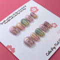 Pastel Holo press-on nails by CutiePop Nail Shop feature extra-short square-shaped nails in soft pastel hues with a mesmerizing holographic finish. This dreamy, iridescent design adds a subtle yet magical glow to your everyday look. Each kit includes 10 reusable handmade nails, jelly adhesive tabs, a mini nail file, and a cuticle stick.

