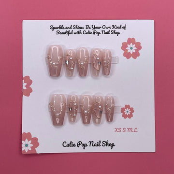 Soft Blush press on nails by CutiePop Nail Shop featuring long coffin shaped nails in soft pink tones with elegant pearl accents for a clean, classy, and feminine look.

