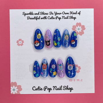 Digipet Evolution press on nails by CutiePop Nail Shop featuring medium almond shaped nails with a glossy royal blue and purple gradient, hand painted with nostalgic anime-style Digipet character silhouettes and sparkly star accents. Includes an easy press on reusable set: adhesive tabs, mini nail file, and cuticle stick.

