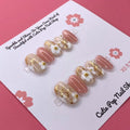 Spring Flowers press-on nails by CutiePop Nail Shop featuring medium-length round-shaped nails in soft pastel tones, adorned with hand-painted floral designs, pearl or gem accents, and a fresh, springtime aesthetic perfect for a cheerful, blooming look.

