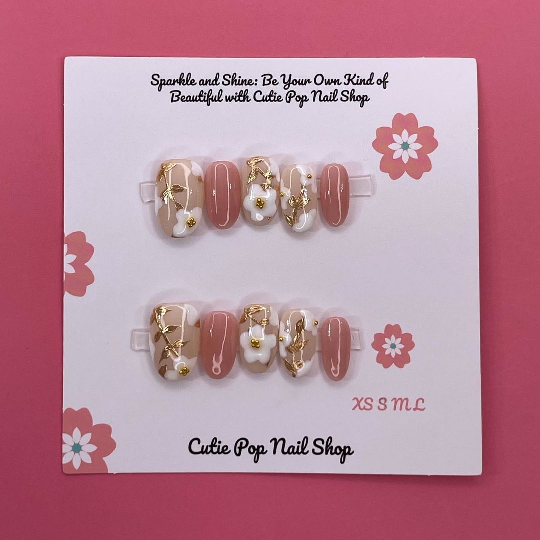 Spring Flowers press-on nails by CutiePop Nail Shop featuring medium-length round-shaped nails in soft pastel tones, adorned with hand-painted floral designs, pearl or gem accents, and a fresh, springtime aesthetic perfect for a cheerful, blooming look.