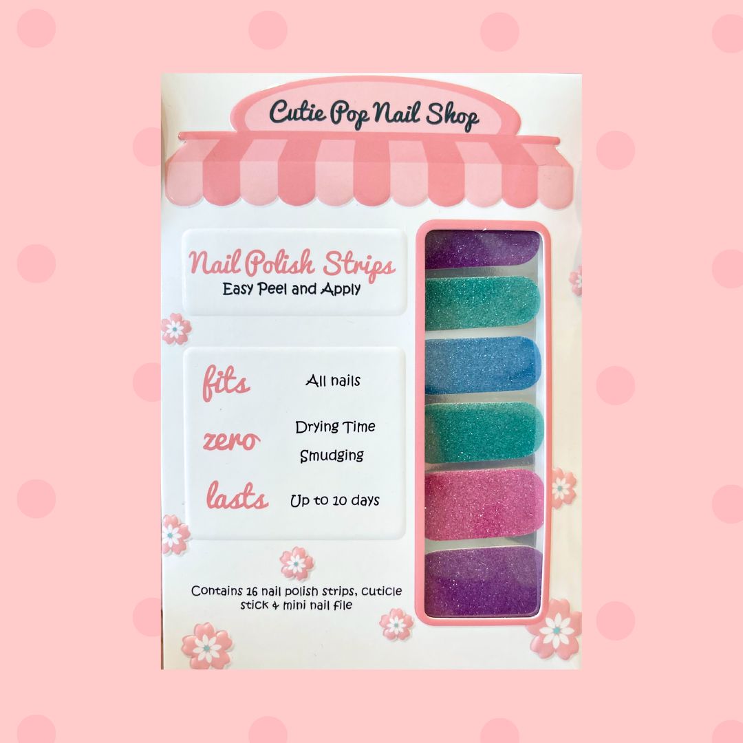 Multicolor Solid Glitter nail polish strips by Cutie Pop Nail Shop featuring shimmering solid shades in lavender, teal, blue, and pink tones with a smooth glitter finish, displayed in a pink-edged packaging labeled "Peel and Apply" and "Up to 10 days.
