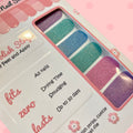 Multicolor Solid Glitter nail polish strips by Cutie Pop Nail Shop featuring shimmering solid shades in lavender, teal, blue, and pink tones with a smooth glitter finish, displayed in a pink-edged packaging labeled 