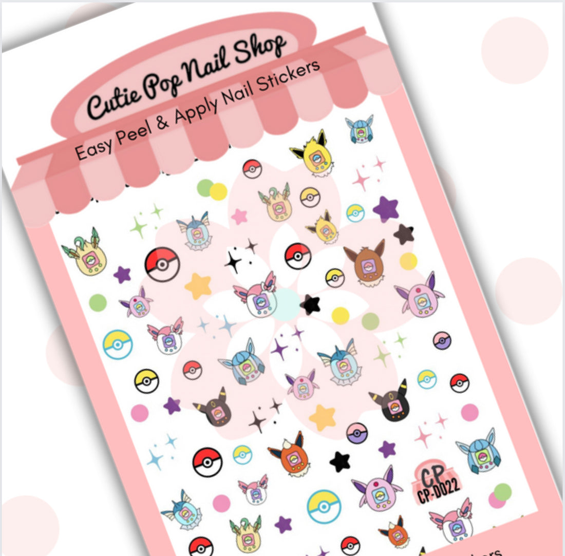 Digipet Eevolution nail stickers by Cutie Pop Nail Shop featuring hand-drawn chibi-style Pokémon designs of Eevee and its fire, water, and electric evolutions in bright pastel colors arranged on a pink edged display card labeled "Easy Peel & Apply Nail Stickers."