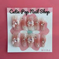 Sweet Moon Guardian press-on nails by CutiePop Nail Shop featuring medium-length coffin-shaped nails in soft pastel tones with dreamy moon and star motifs. Accented with glitter, tiny heart decals, and Sailor Moon-inspired elements, this magical set evokes a sweet celestial vibe. Includes 10 reusable handmade nails, jelly adhesive tabs, mini nail file, and cuticle stick—perfect for moonlit transformations and kawaii fans alike.