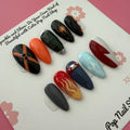 Close-up of MHA BKA anime-inspired medium almond press-on nails with hero character color details