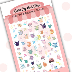 Cutie Pop Nail Shop’s Eevolution nail decals. The nail sticker designs includes pastel fanart of eevee pokemon in various evolving stages. Also included are a range of white-and-red balls, pink, blue, and green crosses, and yellow, purple, blue, and red miscellaneous shapes (stars, triangles, diamonds, circles, asterisks).