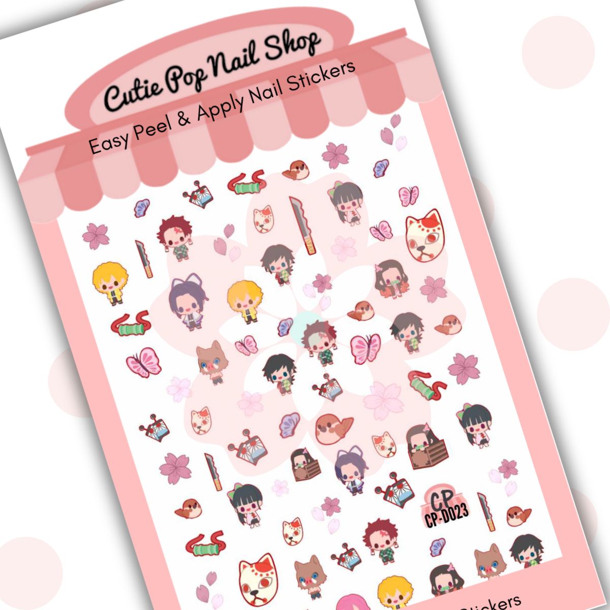 Cutie Pop Nail Shop’s Chibi Slayers nail decals. These kawaii chibi-style fanart nail decal designs include miniature anime slayer characters such as nezuko and tanjiro. The characters are dressed in combat-friendly attire, which is multicolored. Other designs include a bloody knife, a brown sitting bird, a range of light-pink-colored flowers, pink and blue butterflies, pink and white leaves, a person with a boar’s head, a person hiding in a box, and a neko mask.